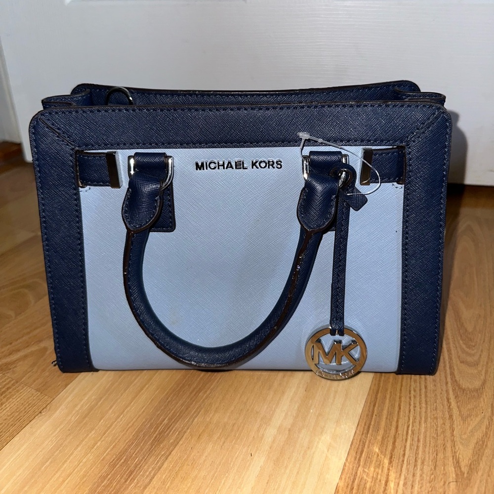 Small Michael Kors tote in light blue with a dark blue trim and silver symbol